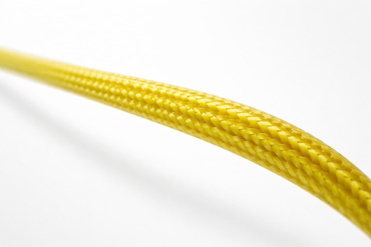 Microscopic zoom of yellow FN9 fiber interlocking weave texture