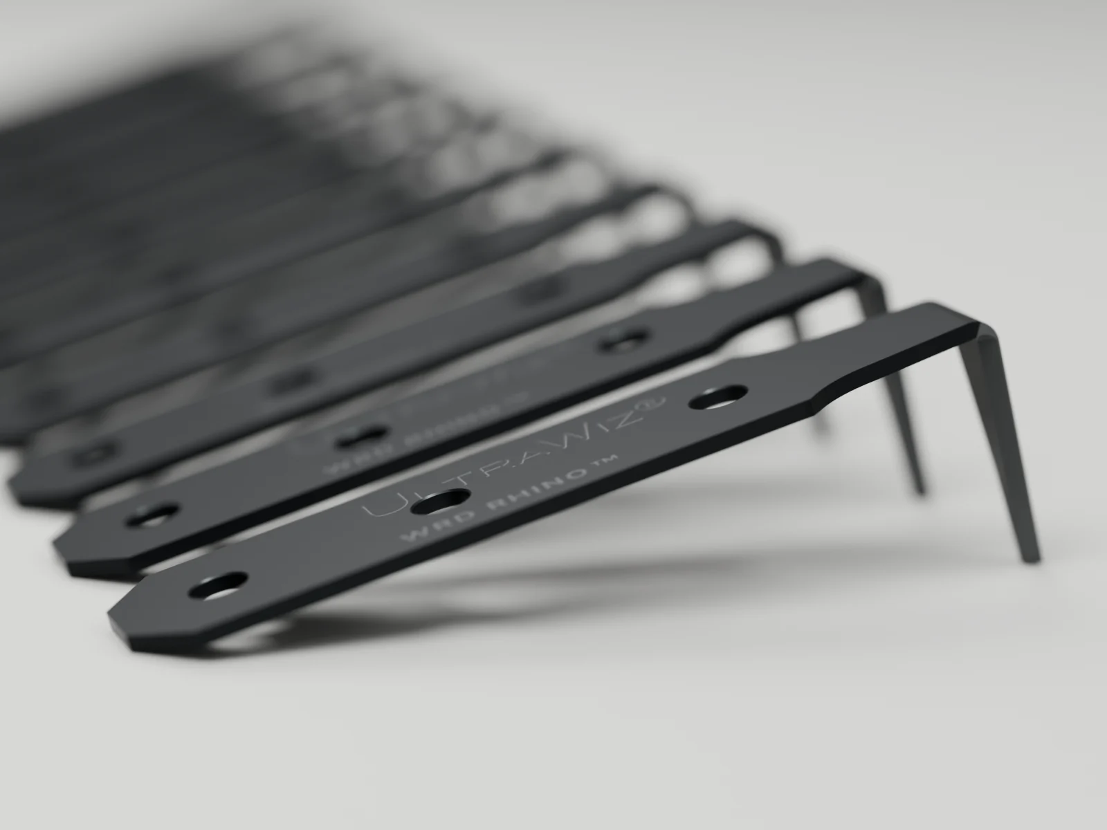 Ten 25 mm Rhino blades lined up in a row, a full pack